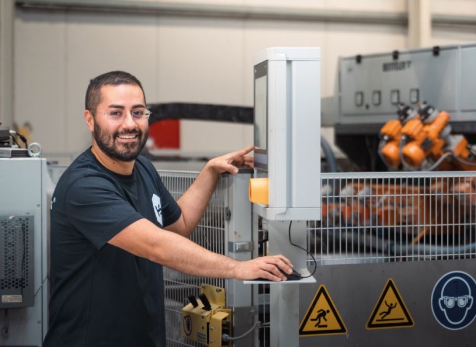 Employees working at a machine